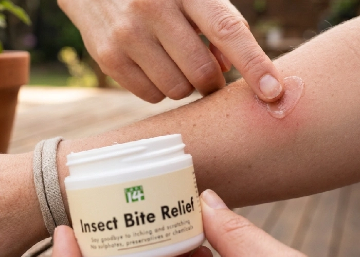 Person applying after bite gel to mosquito bite